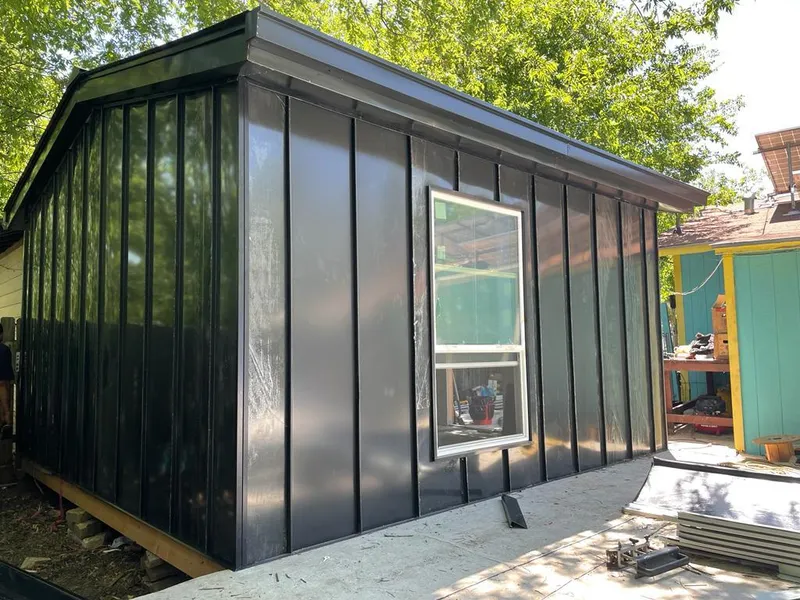 Black standing seam metal wall panels for Roof Inspection in Picture Rocks